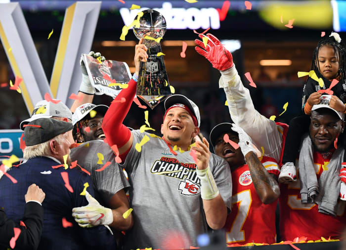Chiefs quarterback Patrick Mahomes (15) hoists the Vince Lombardi Trophy after defeating the 49ers in Super Bowl LIV at Hard Rock Stadium.